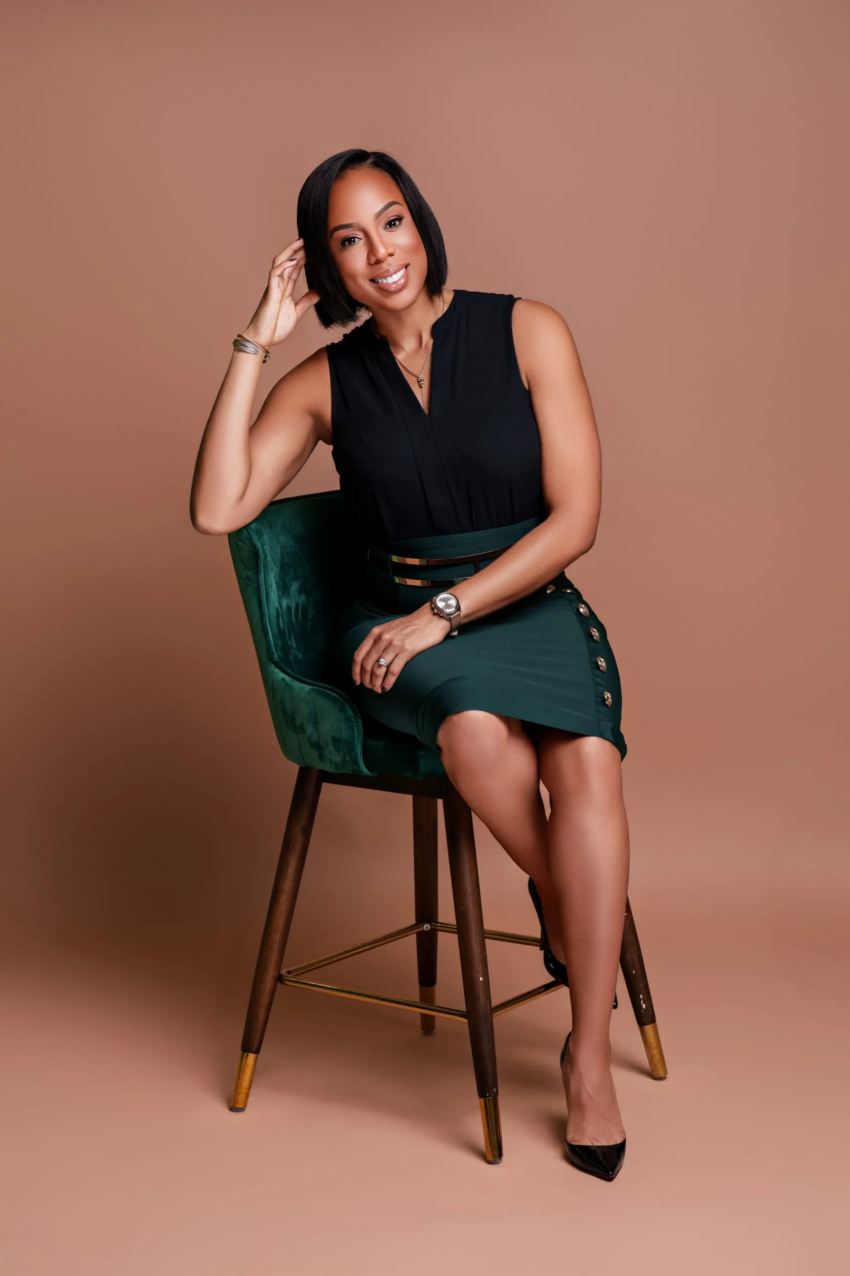 Dr. Okafor seated portrait in black dress